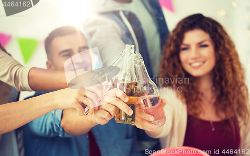 Image of happy team with drinks celebrating at office party