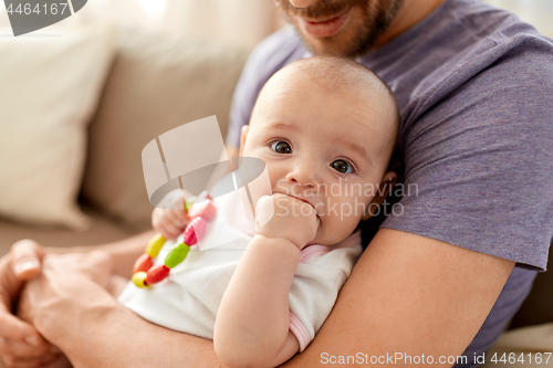 Image of close up of father with little baby girl at home