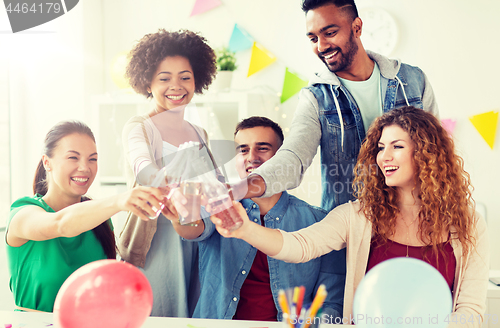 Image of happy team with drinks celebrating at office party