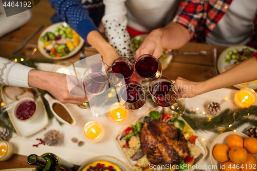 Image of close up of friends with wine celebrate christmas