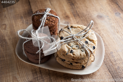 Image of Shortbread, oat cookies, chocolate chip biscuit on wooden background.