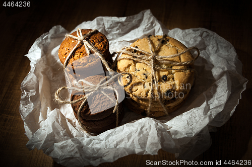 Image of Shortbread, oat cookies, chocolate chip biscuit on wooden background.