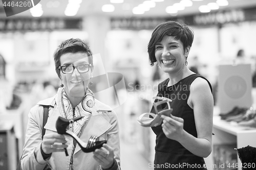 Image of best friend shopping in big mall