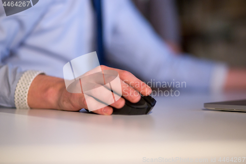 Image of Hand using computer mouse closeup