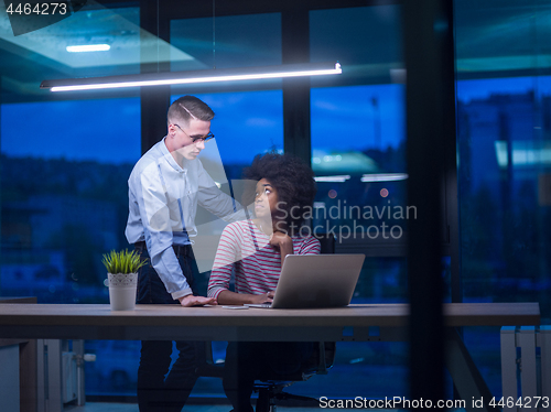 Image of Multiethnic startup business team in night office