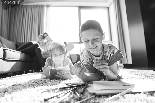 Image of young couple spending time with kids