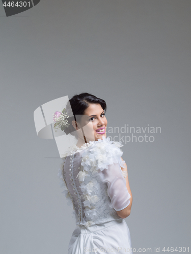 Image of Rear view of a beautiful young woman in a wedding dress