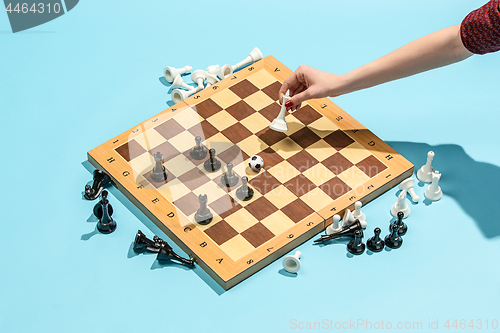 Image of soccer ball of chess pieces on the board