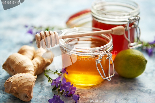 Image of Healthy food table with different kinds of honey, fresh ginger and lime