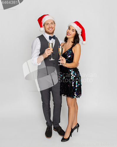 Image of couple with champagne glasses at christmas party