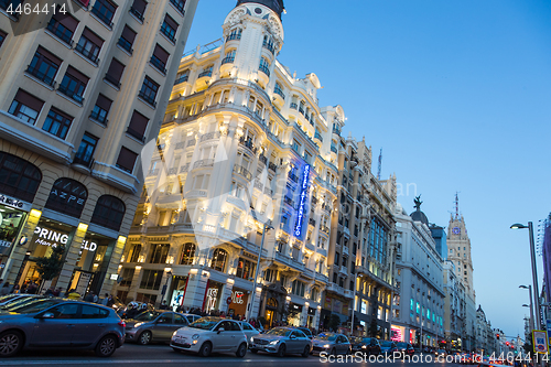 Image of Madrid, Spain. Gran Via, main shopping street at dusk.