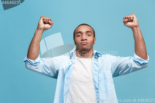 Image of Winning success man happy ecstatic celebrating being a winner. Dynamic energetic image of male model