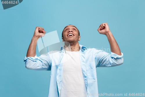 Image of Winning success man happy ecstatic celebrating being a winner. Dynamic energetic image of male model