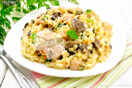 Image of Risotto with mushrooms and chicken on table