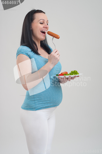 Image of Pregnant woman on gray