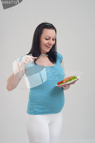 Image of Pregnant woman on gray