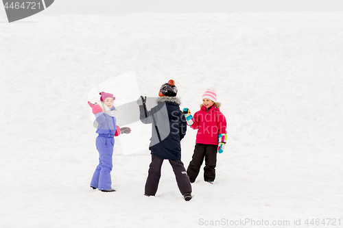 Image of happy little kids playing outdoors in winter