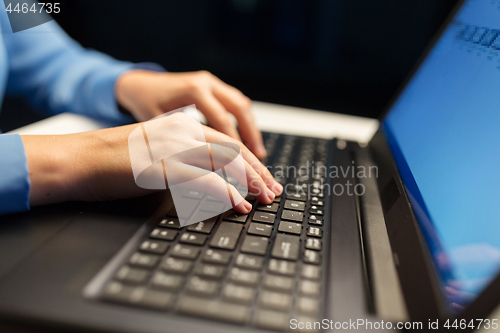 Image of close up of female hands with laptop typing