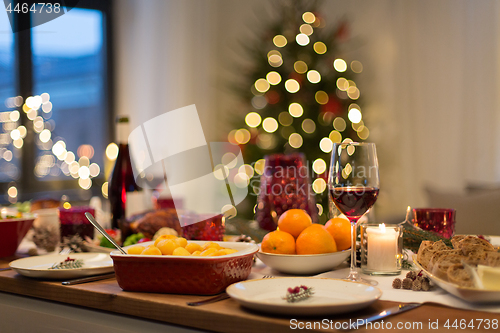 Image of food and drinks on christmas table at home