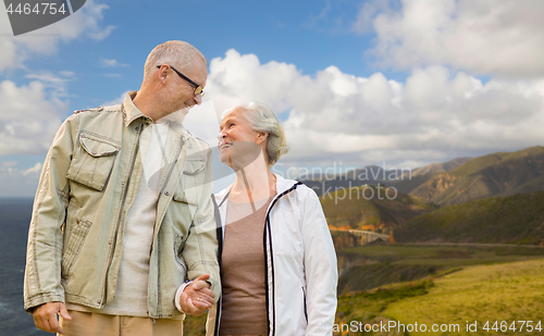 Image of happy senior couple over big sur coast