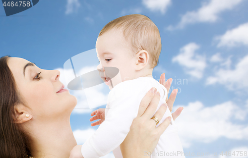 Image of mother with baby over sky background