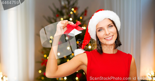 Image of woman in santa hat with jingle bells on christmas