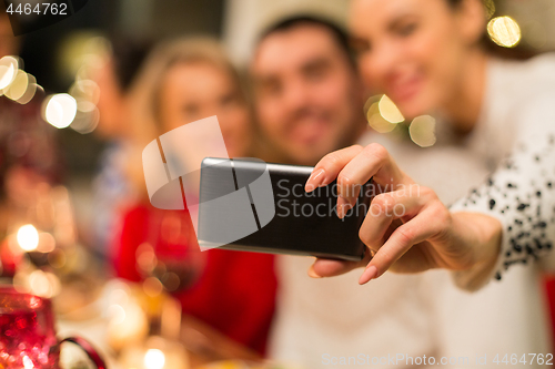 Image of close up of friends taking selfie on christmas