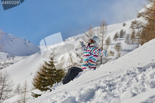 Image of Snowboarder having a rest