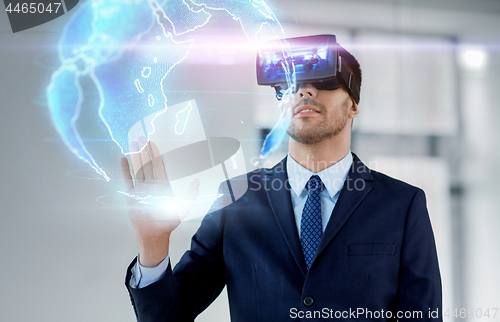 Image of businessman with virtual reality headset at office