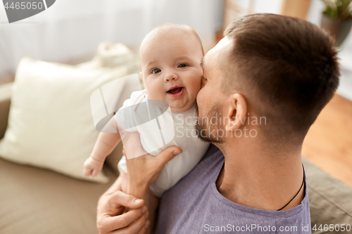 Image of close up of father with little baby girl at home