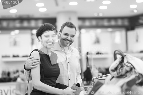 Image of couple chooses shoes At Shoe Store