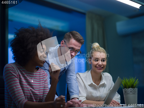 Image of Multiethnic startup business team in night office