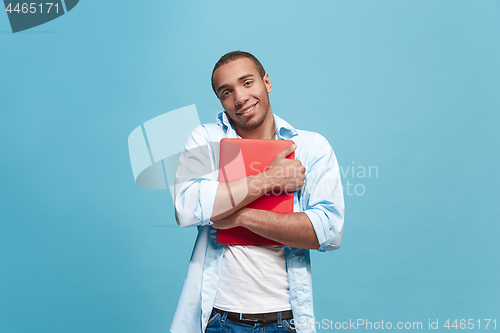 Image of Businessman hugging laptop