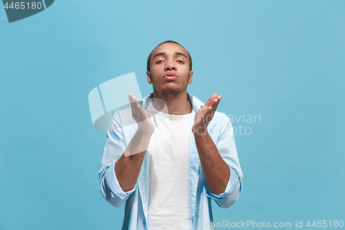 Image of Portrait of attractive man with kiss isolated over blue background