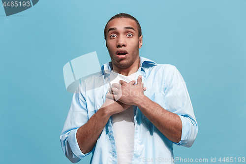 Image of Portrait of the scared man on blue