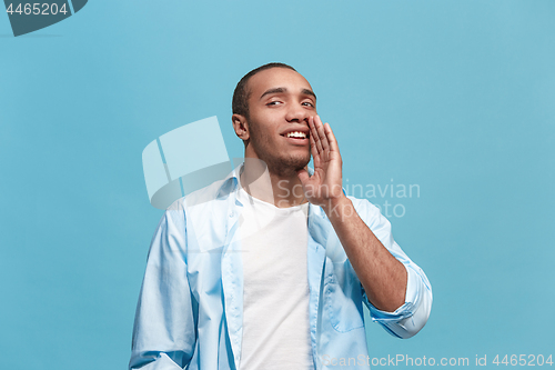 Image of Isolated on pink young casual man shouting at studio