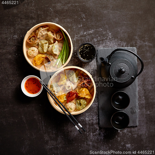 Image of Composition of chinese food. Mixed kinds of dumplings from woode