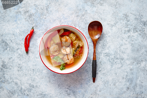 Image of Traditional Tom Yum spicy Thai soup with shrimp