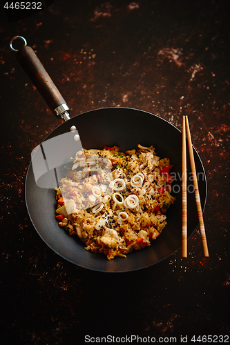 Image of Delicious fried rice with chicken in wok