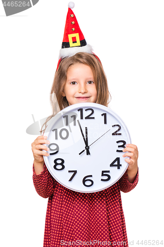 Image of Girl in santa hat with clock