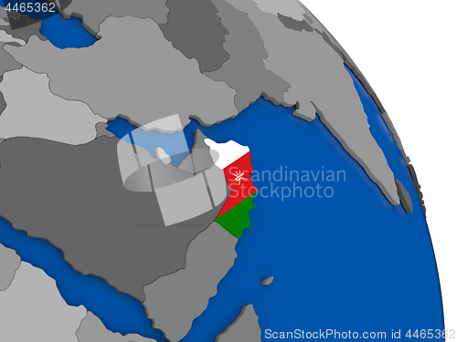 Image of Oman and its flag on globe