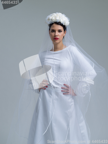 Image of young bride in a wedding dress with a veil