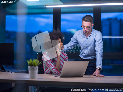 Image of Multiethnic startup business team in night office