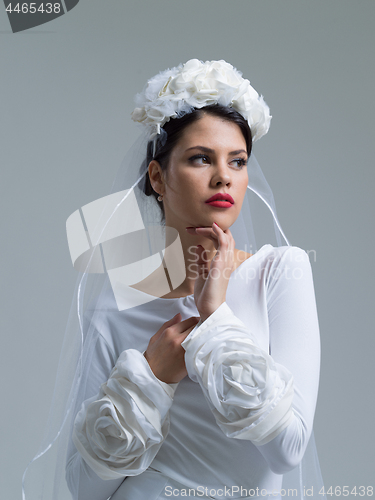 Image of young bride in a wedding dress with a veil