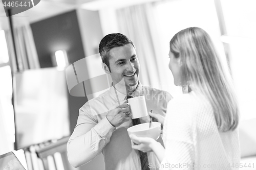 Image of A young couple is preparing for a job and using a laptop