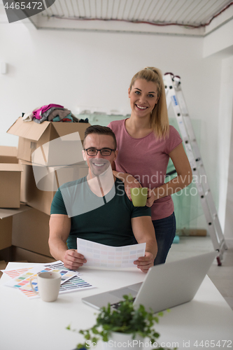 Image of Young couple moving in a new home