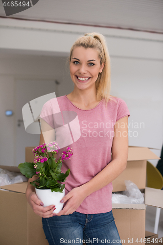 Image of girl moving in the new apartment