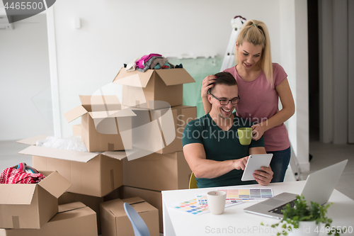 Image of Young couple moving in a new home