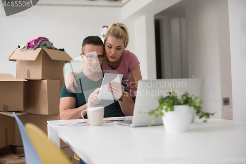 Image of Young couple moving in a new home