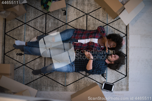 Image of Top view of attractive young multiethnic couple